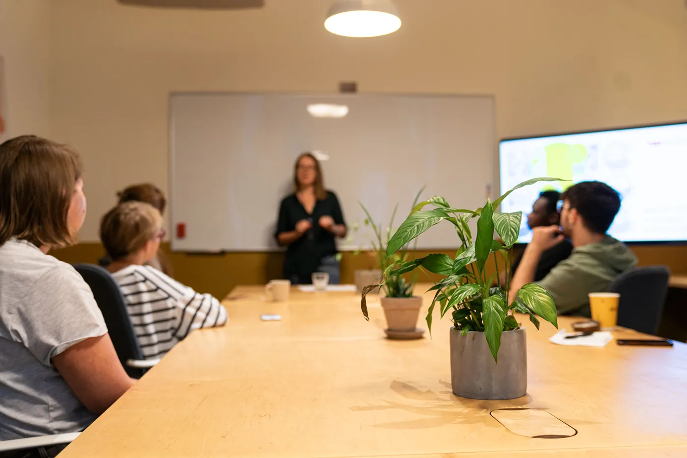 Meeting room at Yolk Coworking Kraków with 4K screen and professional setup
